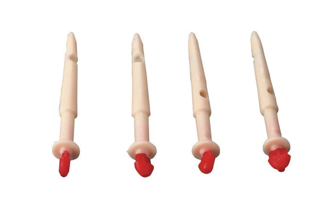 Zitzenkanüle in gelbem Behälter mit grünem Aufkleber